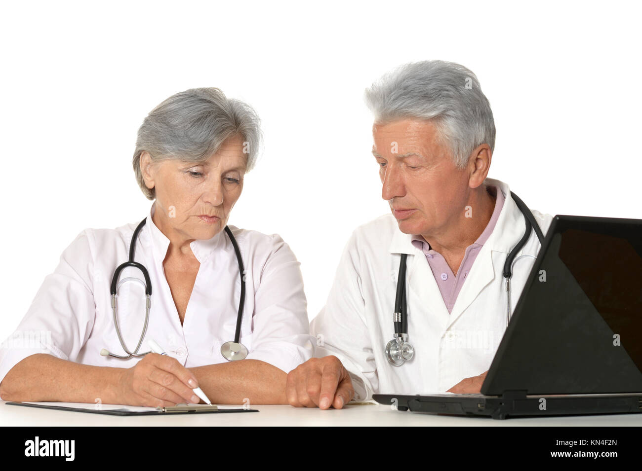 Elderly doctors with a laptop  Stock Photo