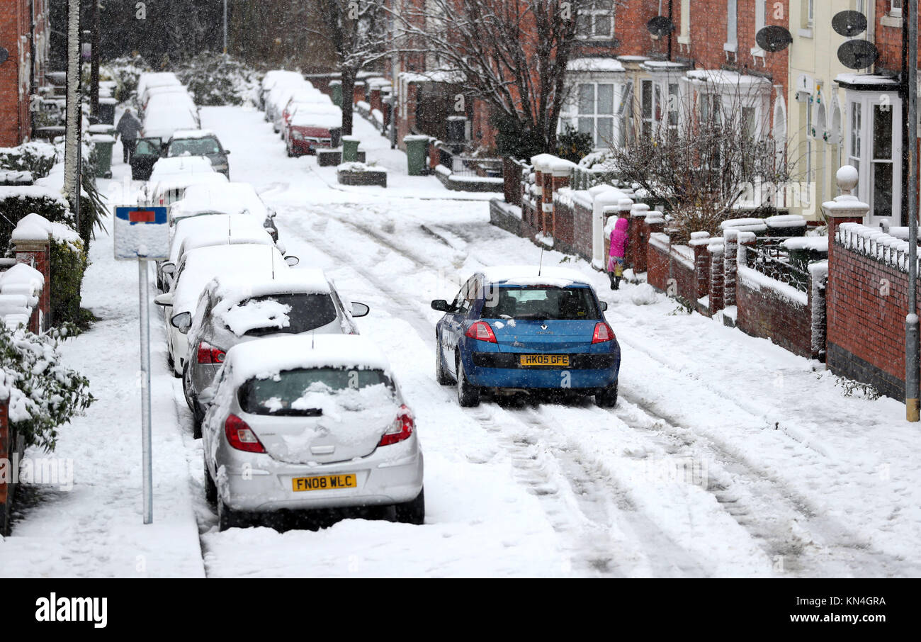 Motorists brave the snow in Worcester, as heavy snowfall across parts of the UK is causing widespread disruption, closing roads and grounding flights at an airport. Stock Photo
