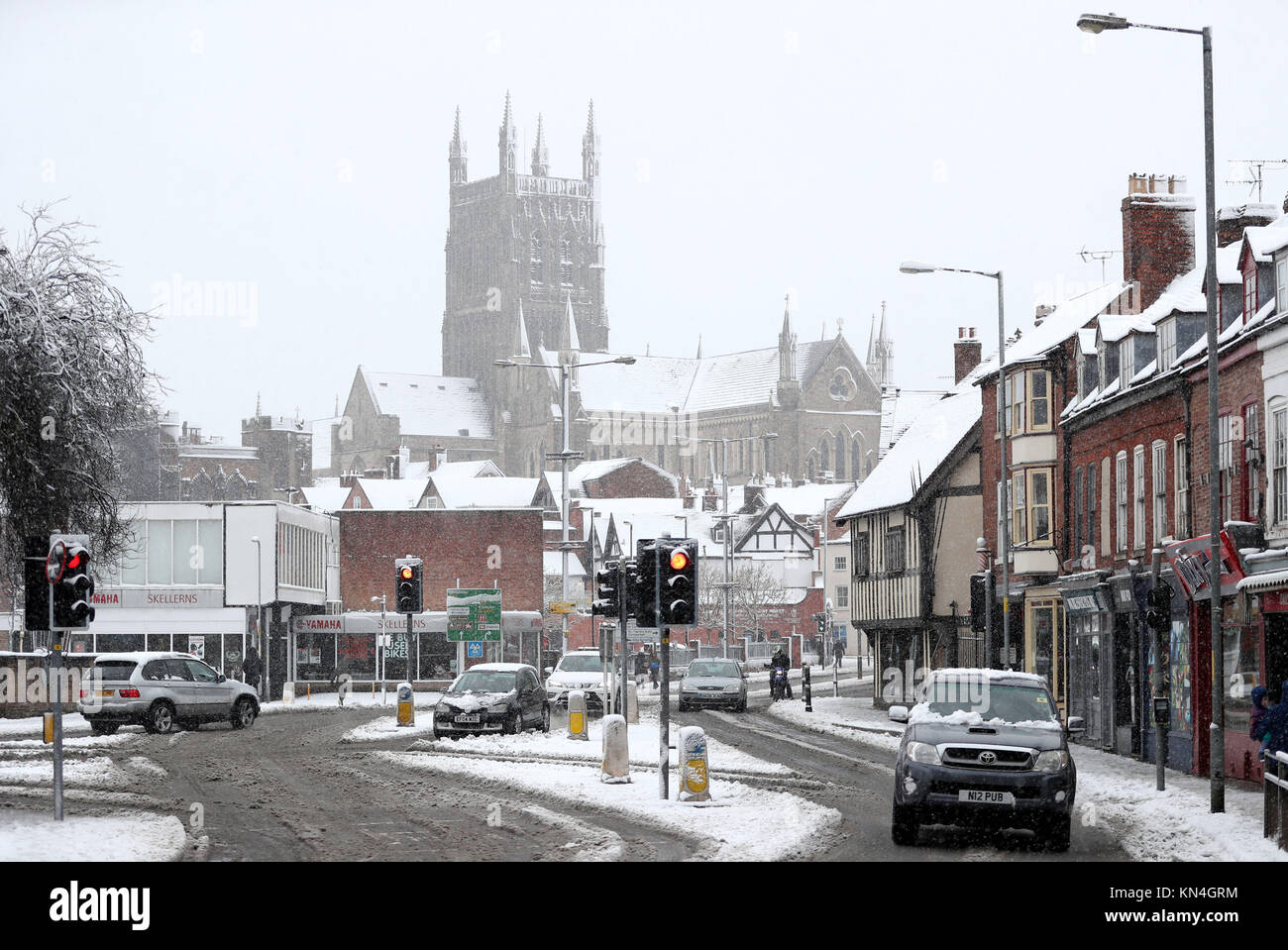 Motorists brave the snow in Worcester, as heavy snowfall across parts of the UK is causing widespread disruption, closing roads and grounding flights at an airport. Stock Photo