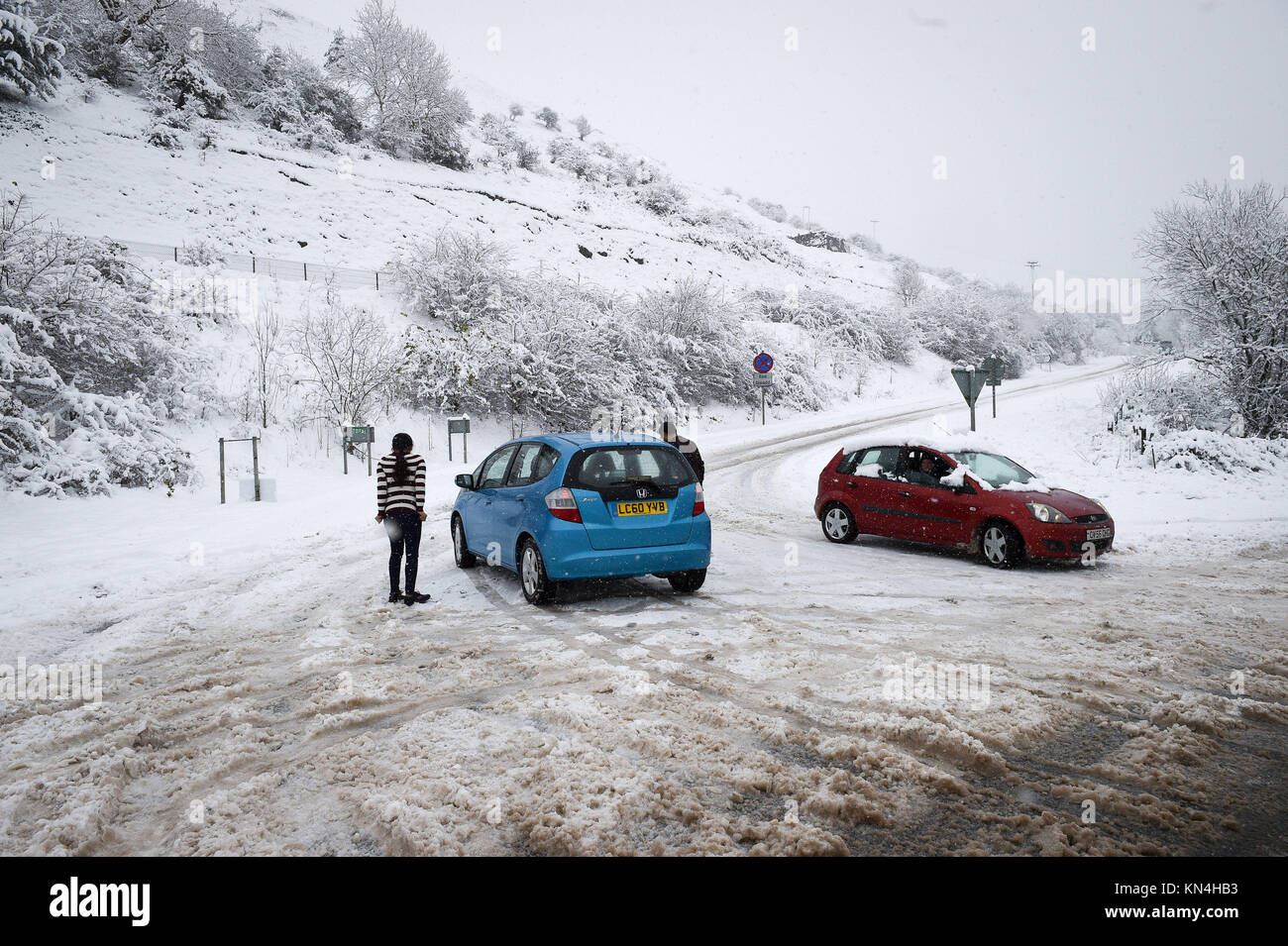 People turn their cars around near a road closure on the A470 from Merthyr Tydfil to Brecon, Wales, as heavy snowfall across parts of the UK is causing widespread disruption, closing roads and grounding flights at an airport. Stock Photo