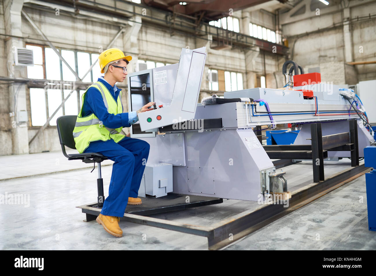 Operating CNC Machine Stock Photo