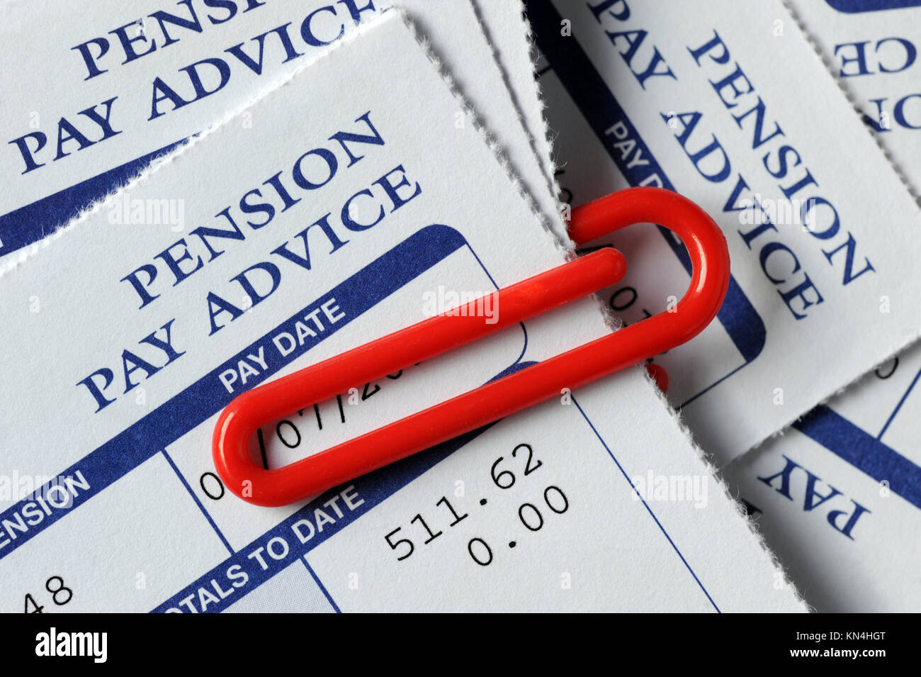 COMPANY PENSION PAY ADVICE SLIPS WITH RED PAPER CLIP RE WORKPLACE PENSIONS COMPANY SCHEMES PENSIONS UK Stock Photo