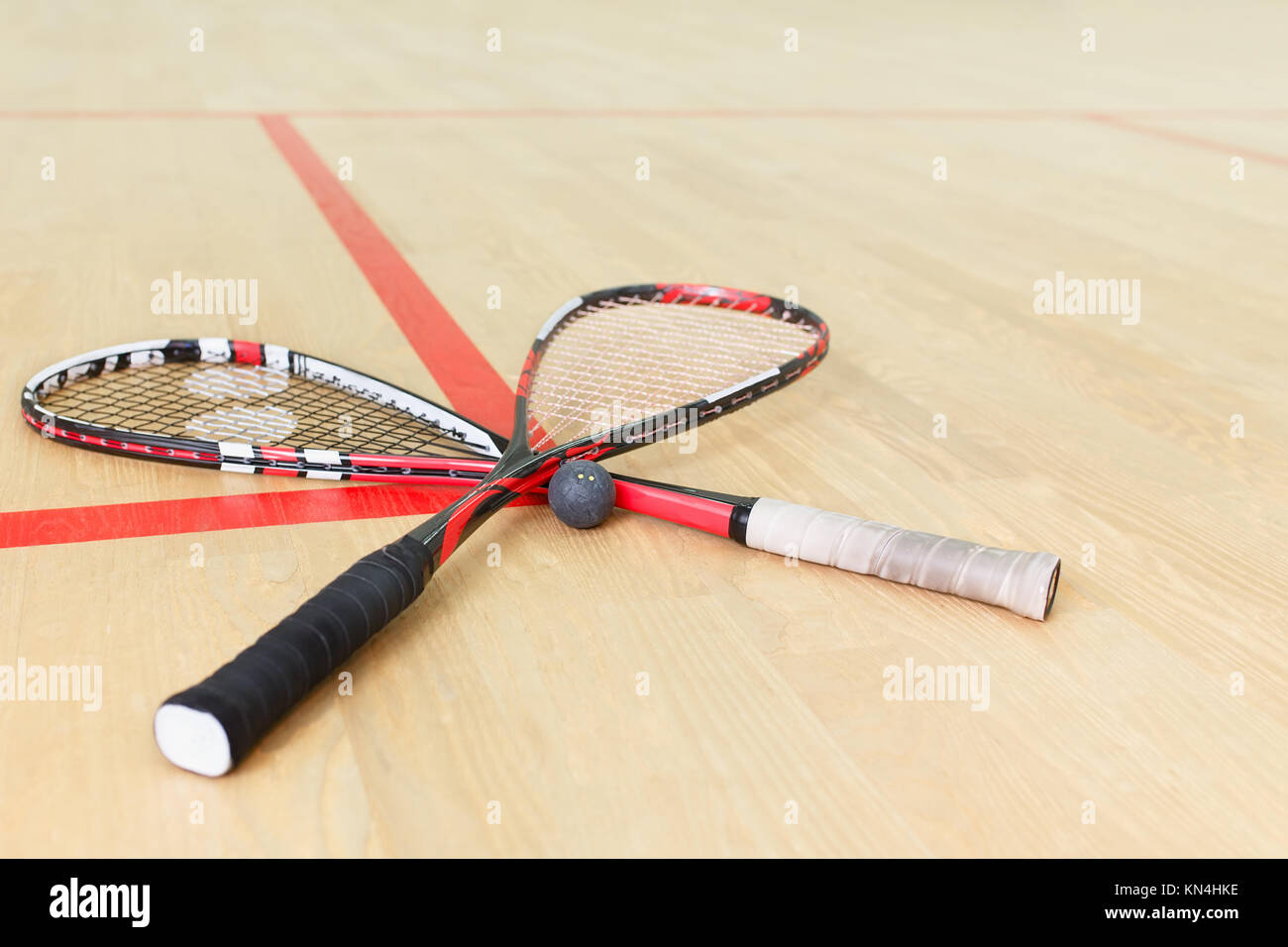 two squash rackets and ball Stock Photo Alamy