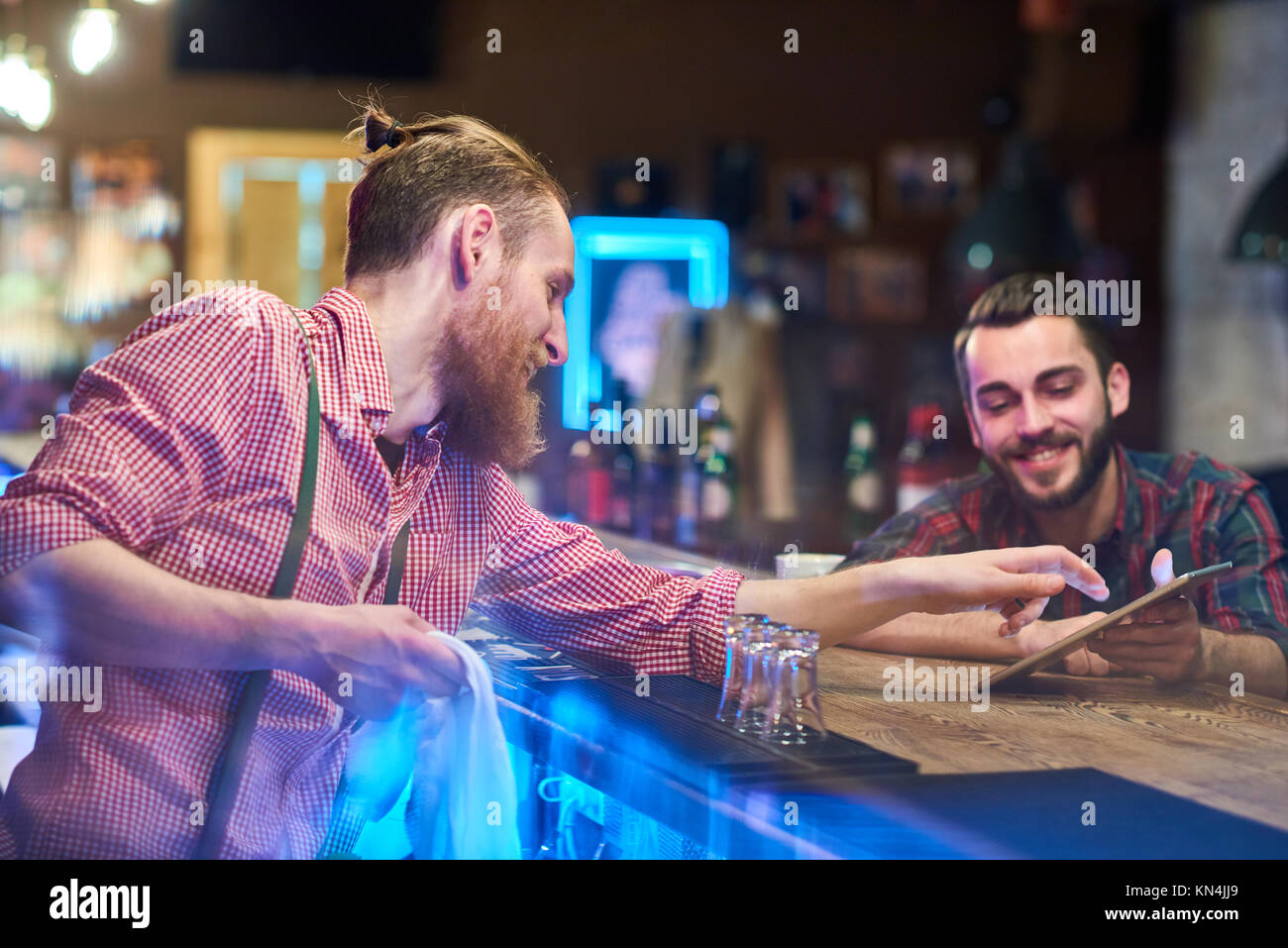 Bartender Helping Guest Choosing Drinks Stock Photo
