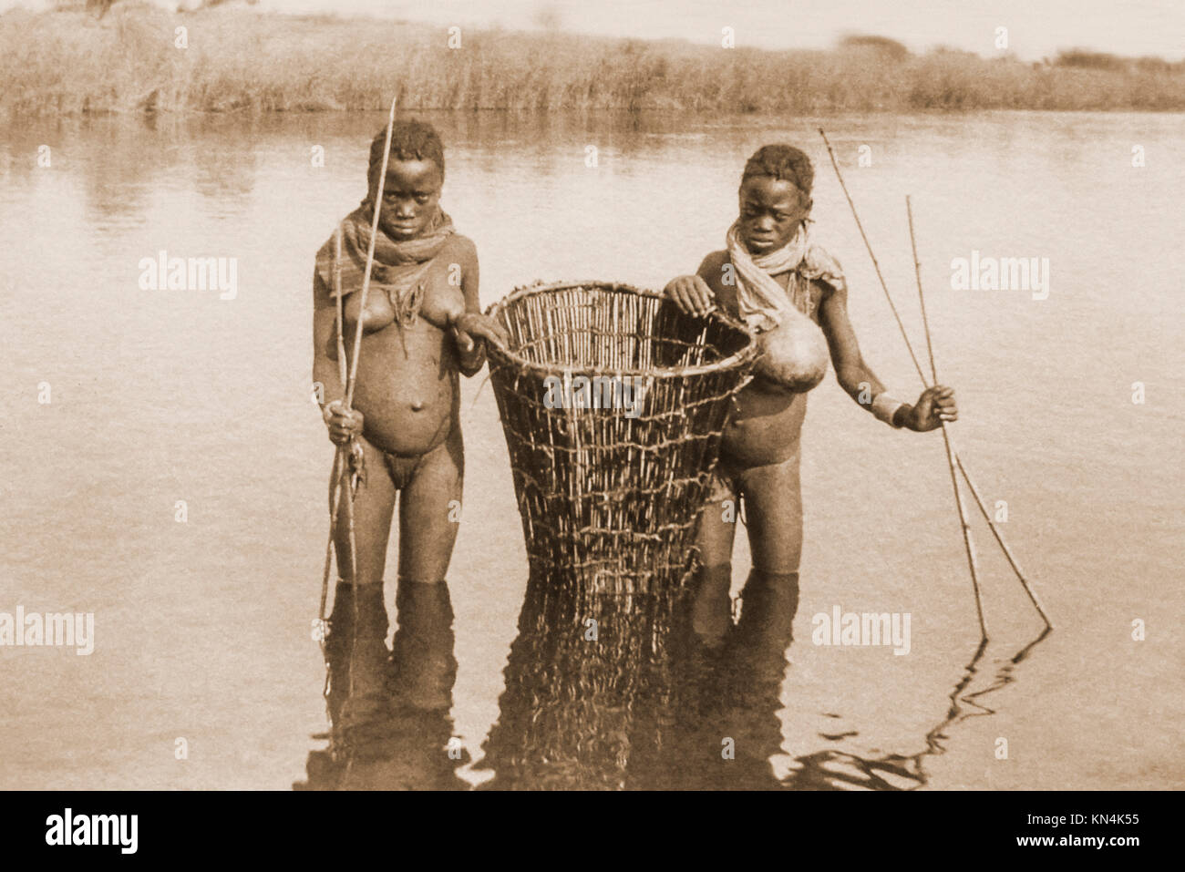 African girl fishing in a river hi-res stock photography and