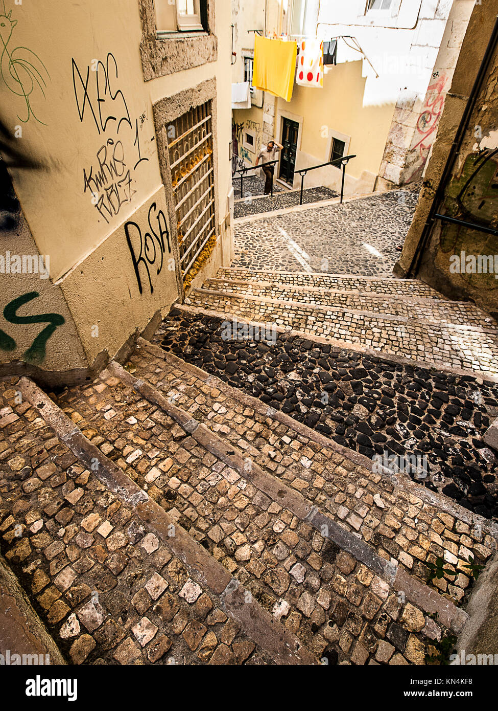 Cobbled stairs in Lisbon. Single person in the background Stock Photo