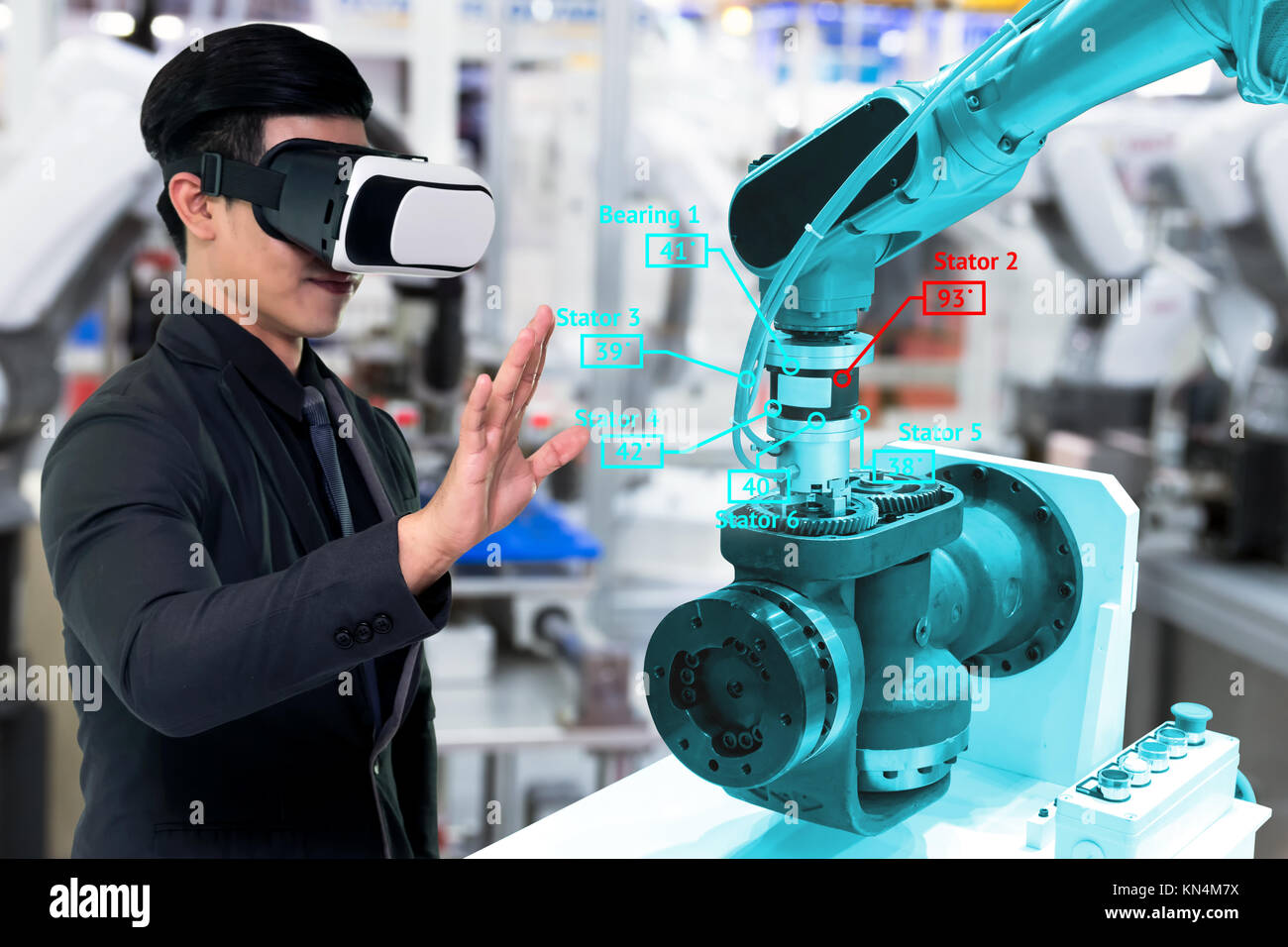 Virtual reality technology in industry 4.0. Business man suit wearing VR glasses to see AR service , Thermal Monitoring motor for check destroy part o Stock Photo