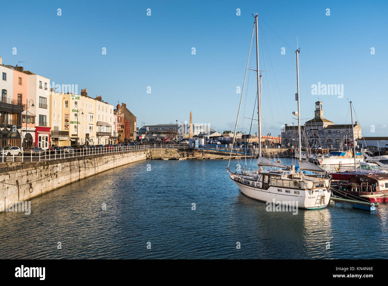 RAMSGATE, ENGLAND - NOV 23 2017.  Buildings  and boats in and around the marina in the winter evening sunshine. The town has one of the largest marina Stock Photo