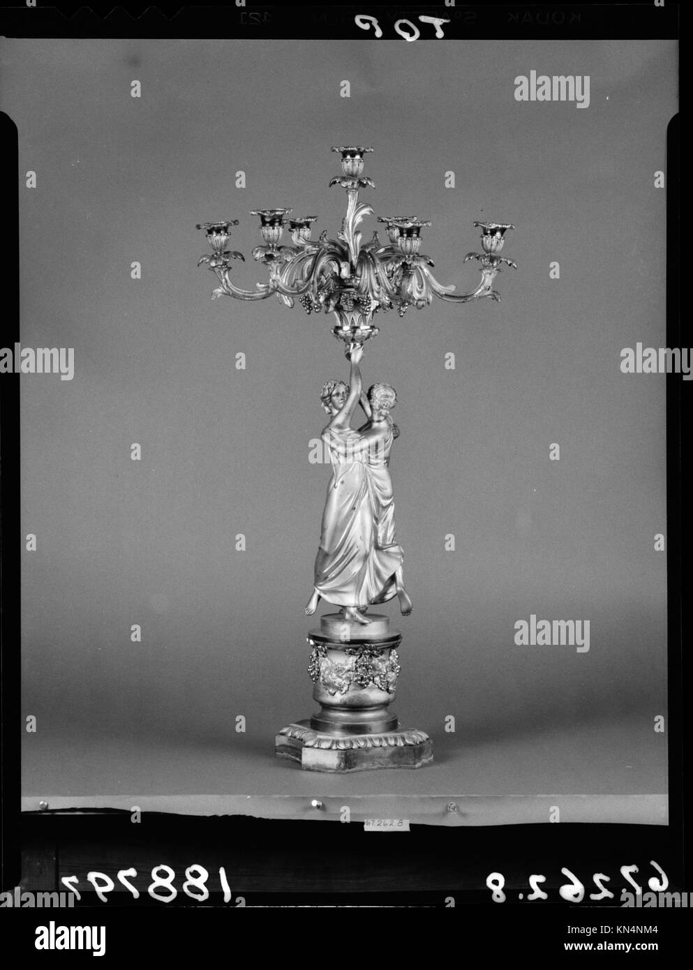 Candelabrum MET 188797 1124 Candelabrum, ca. 1836, Gilt bronze, H. 32 1/2 in. (82.6 cm); Diam. 17 1/2 in. (44.5 cm). The Metropolitan Museum of Art, New York. Gift of John C. Cattus, 1967 (67.262.8) Stock Photo