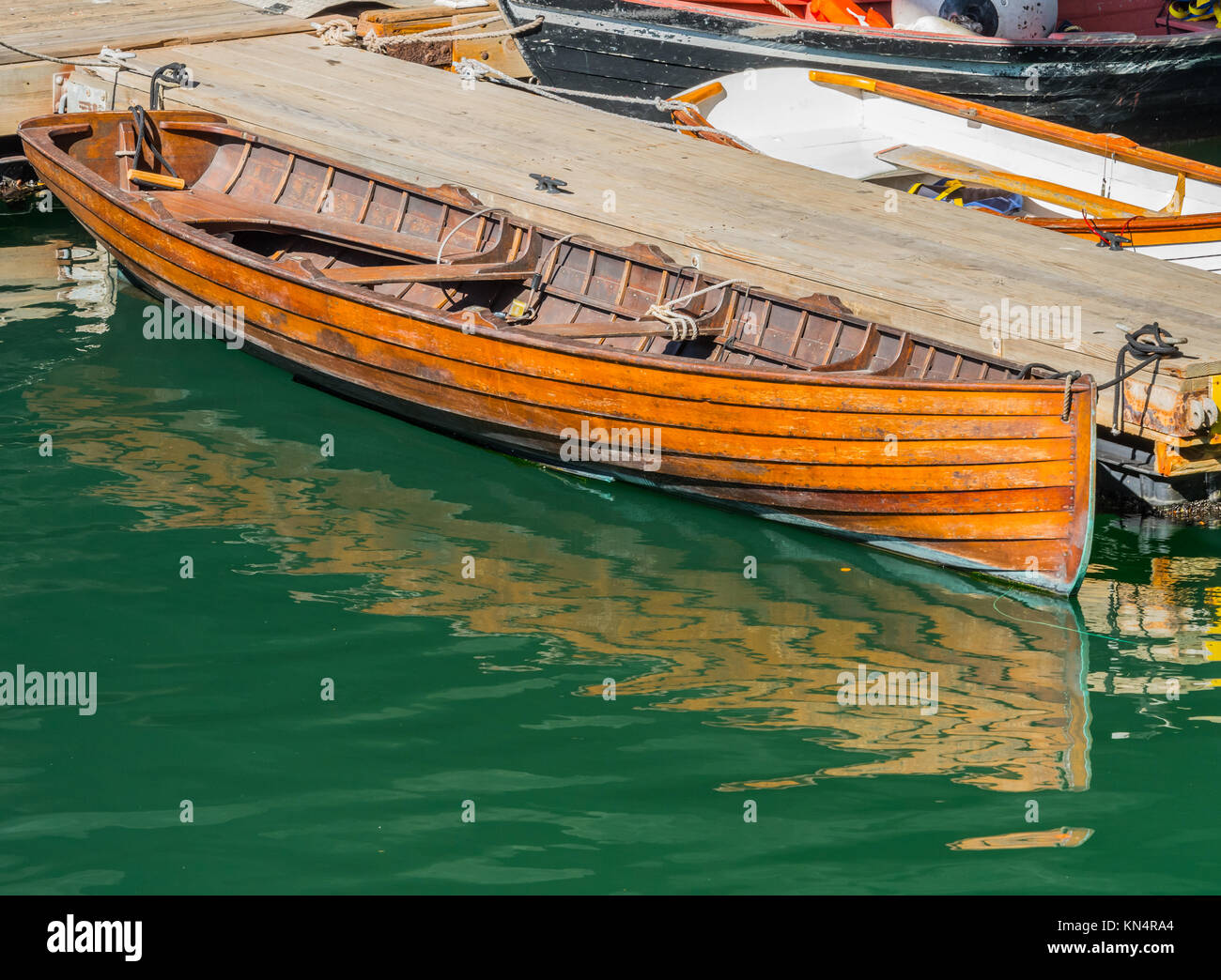 Old Wooden Boat Tied to Dock in Boston harbor Stock Photo - Alamy
