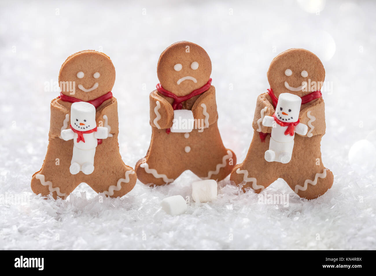 Funny Gingerbread cookie men with marshmallow snowman Stock Photo Alamy
