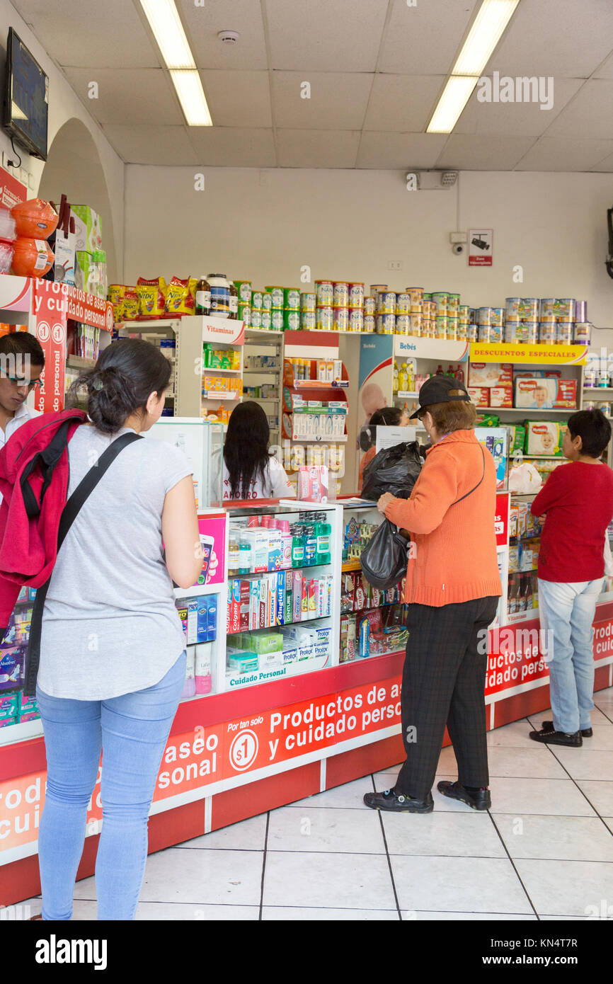 Ecuador pharmacy - local ecuadorian people shopping in a chemist shop or pharmacy, Quito, Ecuador South America Stock Photo