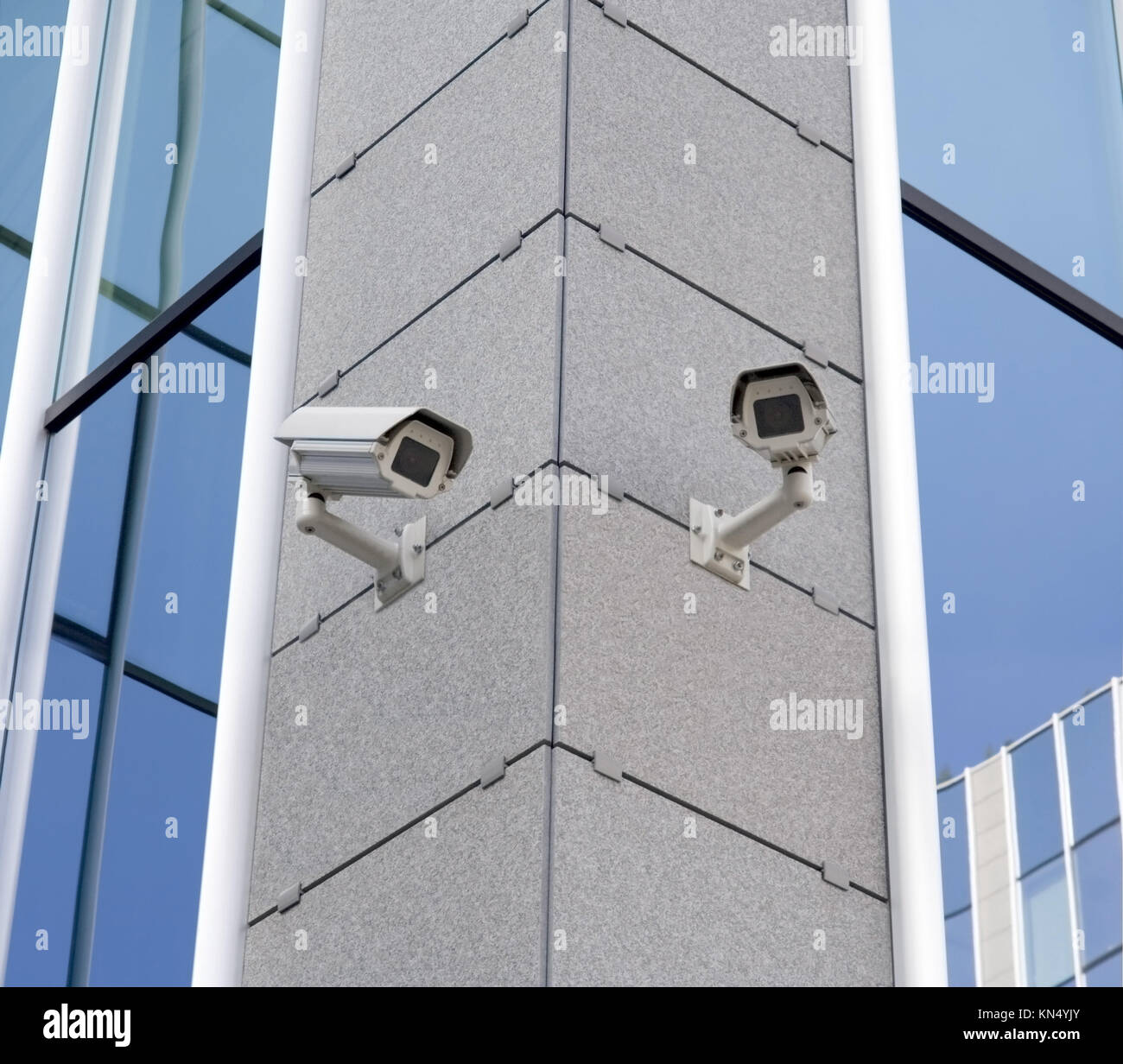 Two security cameras attached on building corner Stock Photo Alamy