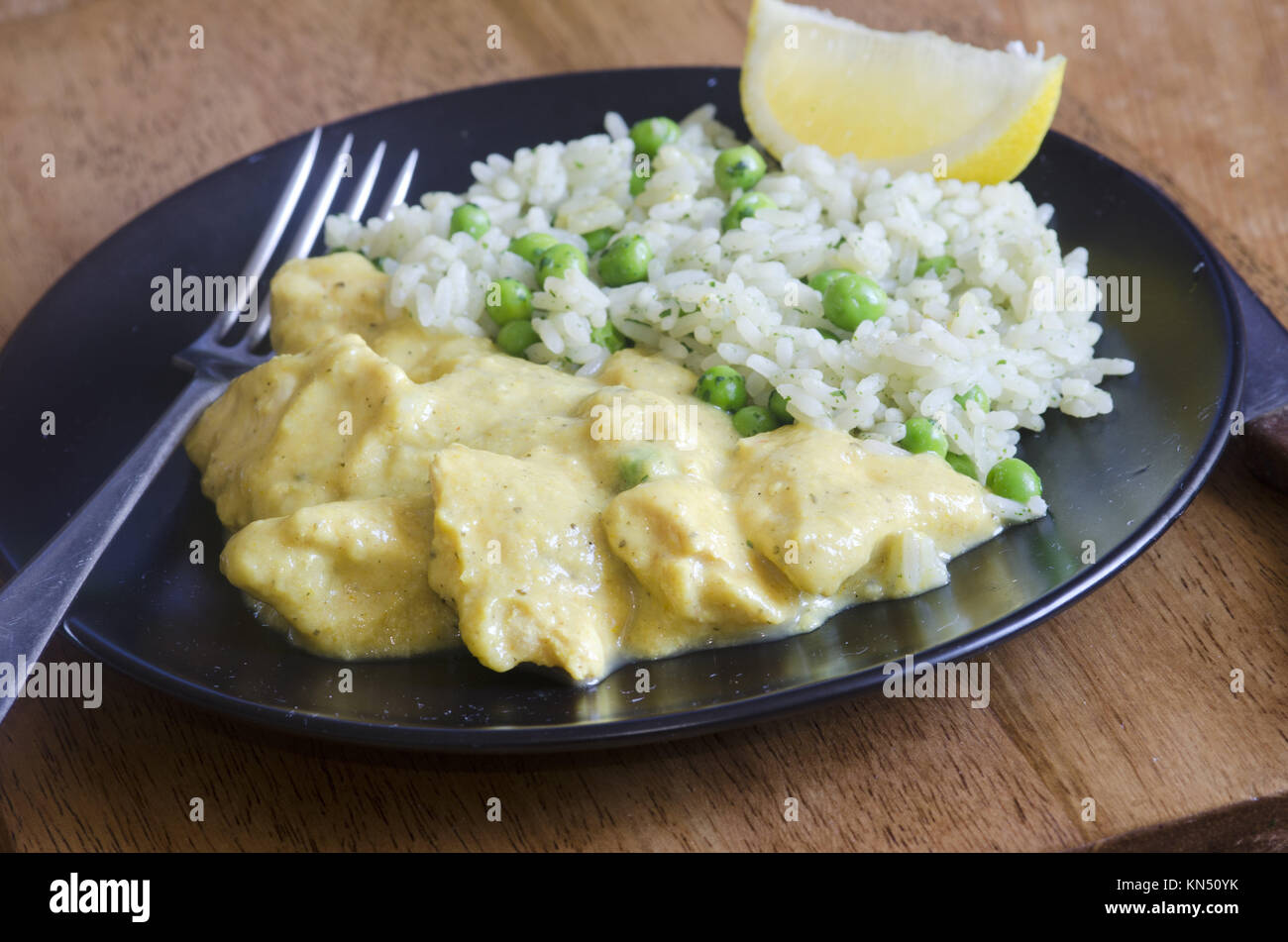 Lemon and ginger chicken curry with pilaf Stock Photo Alamy