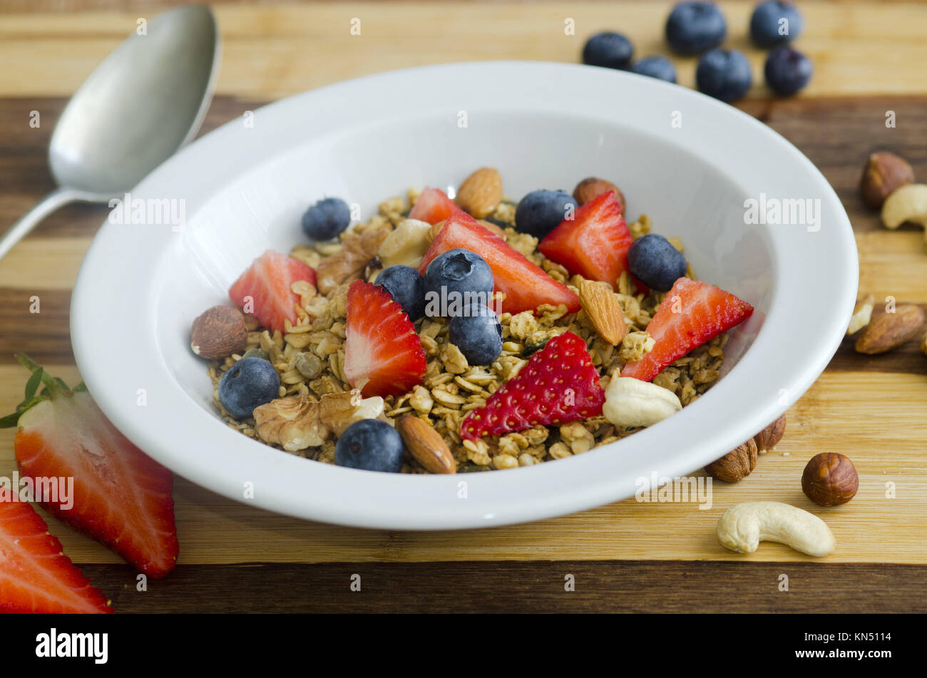 Healthy muesli with fresh fruit and nuts Stock Photo Alamy