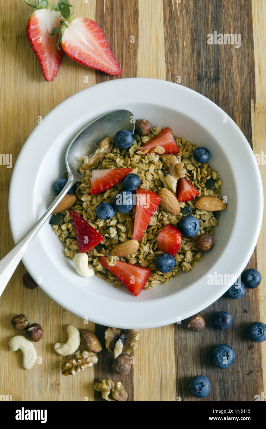 Healthy muesli with fresh fruit and nuts Stock Photo Alamy