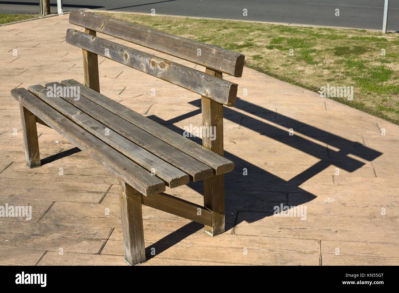 Rustic wooden bench in the park, Huelva, Spain. Stock Photo