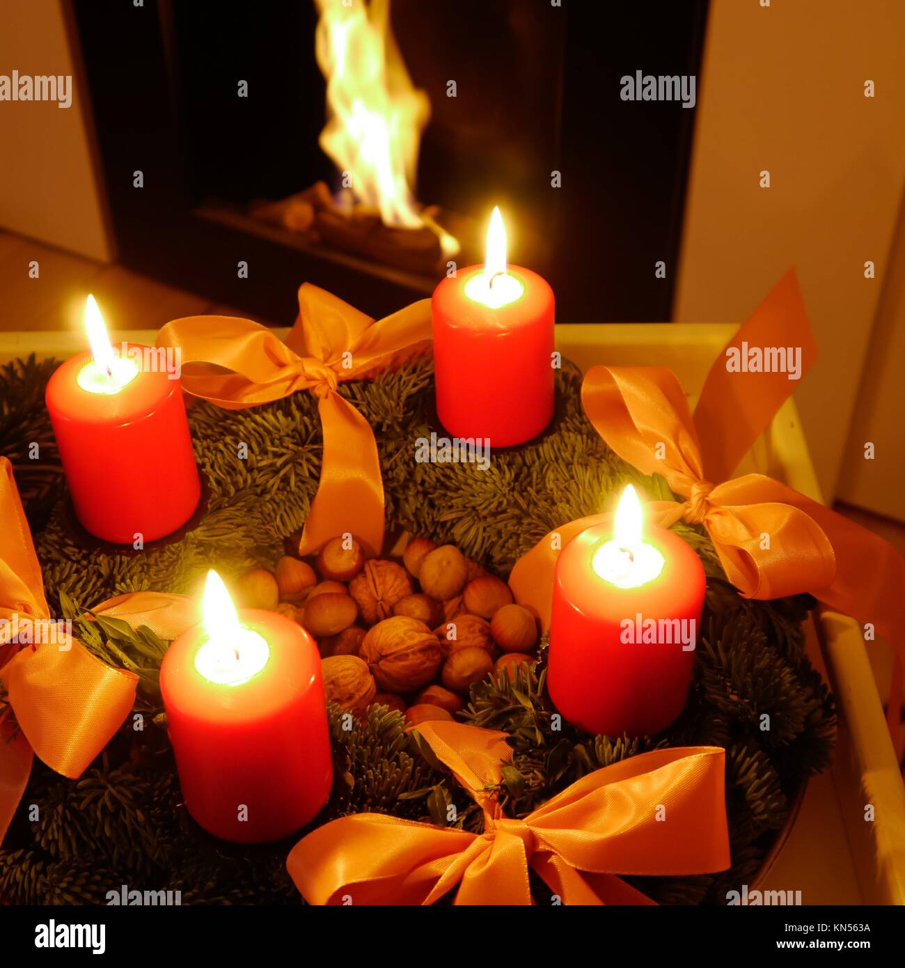 advent wreath with red candles and fireplace Stock Photo Alamy