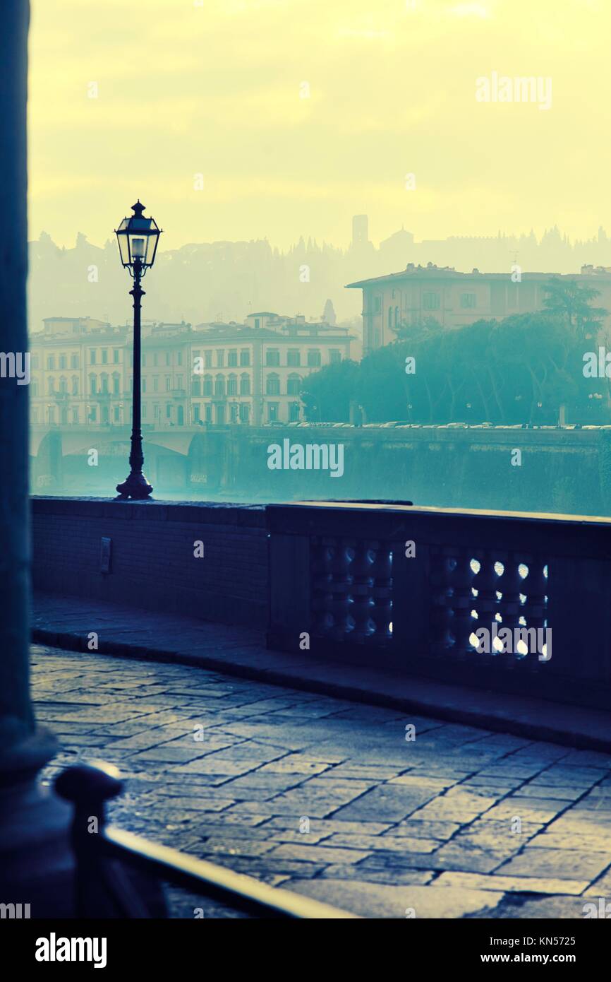 View of the embankment morning in Florence.Photo executed in a range of ''cross processing''. Stock Photo