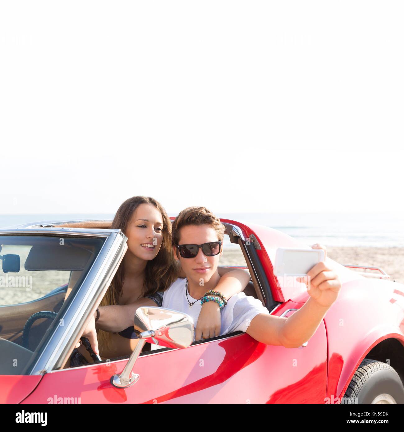 Young woman in red convertible hi-res stock photography and images - Alamy