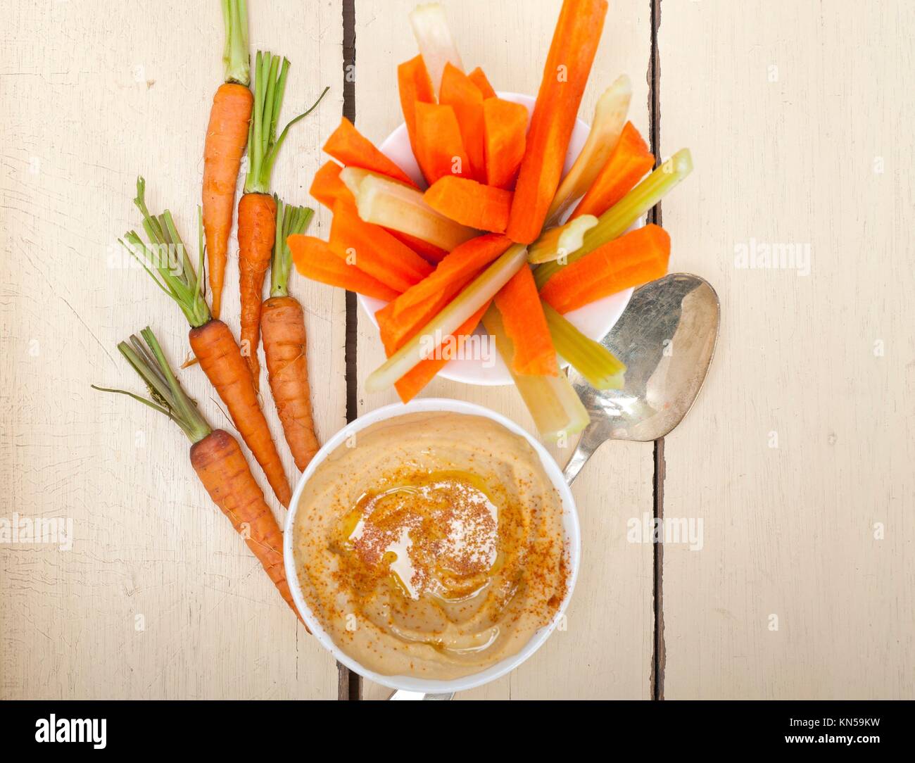 fresh hummus dip with raw carrot and celery arab middle eastent healthy