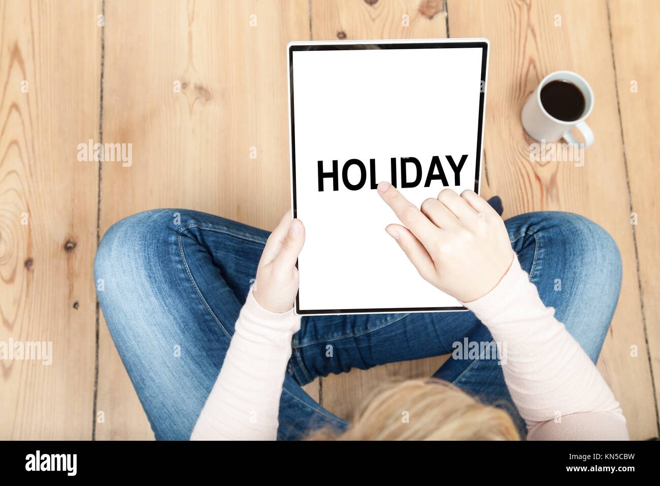 choose holiday on a tablet. Stock Photo