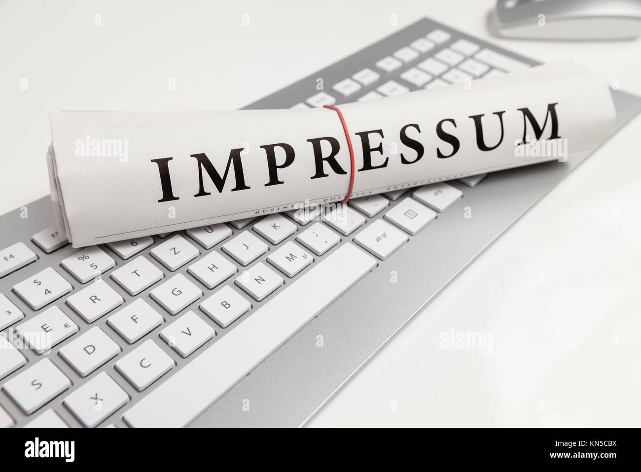 imprint written in german on desk Stock Photo Alamy