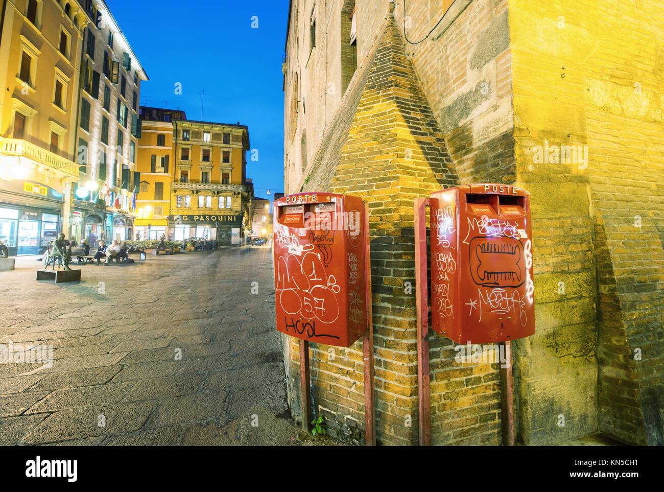 BOLOGNA, ITALY OCTOBER 9, 2014 Red mail boxes outside a post office in Bologna at night Stock