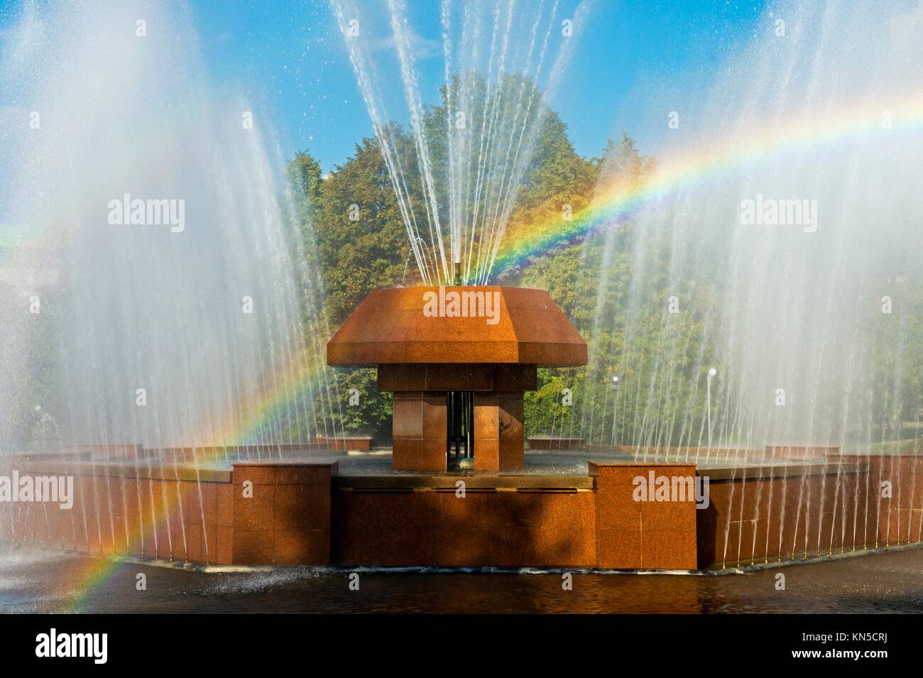 Rainbow in the waterdrops of a fountain, Almaty, Kazakhstan. Stock Photo