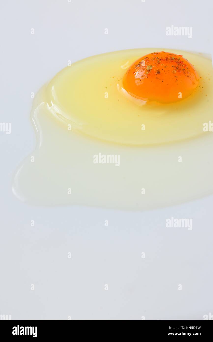 Egg yolk closeup on white, top view Stock Photo - Alamy