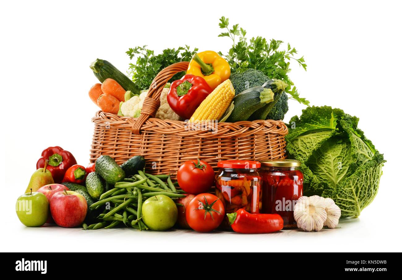 Wicker basket with groceries isolated on white background Stock Photo