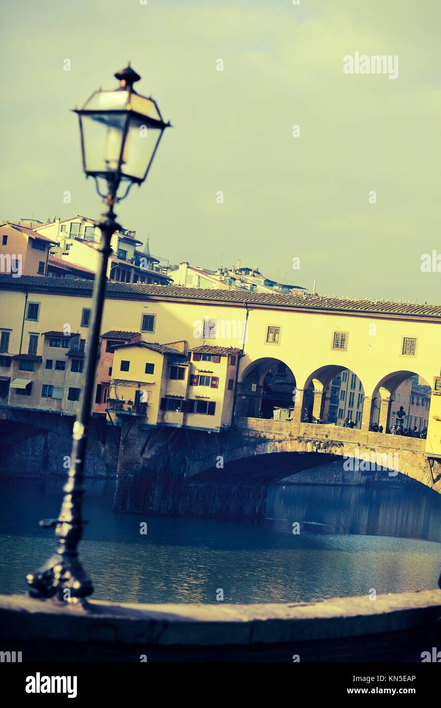 Street lamp in front of Ponte Vecchio. Photo executed in a range of ''cross processing''. Stock Photo