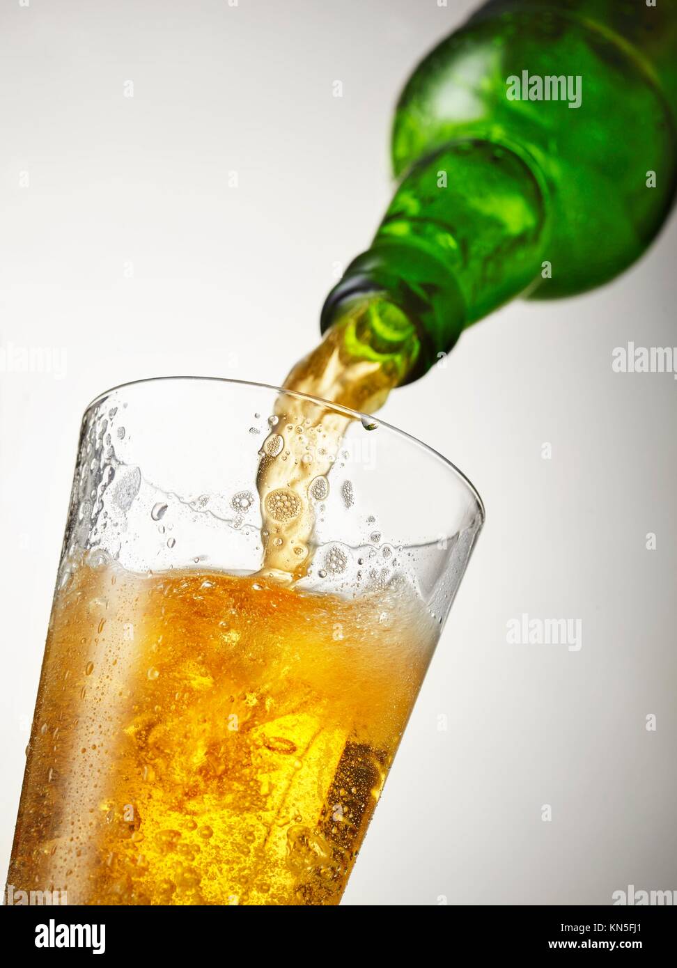 beer is pouring into glass Stock Photo Alamy