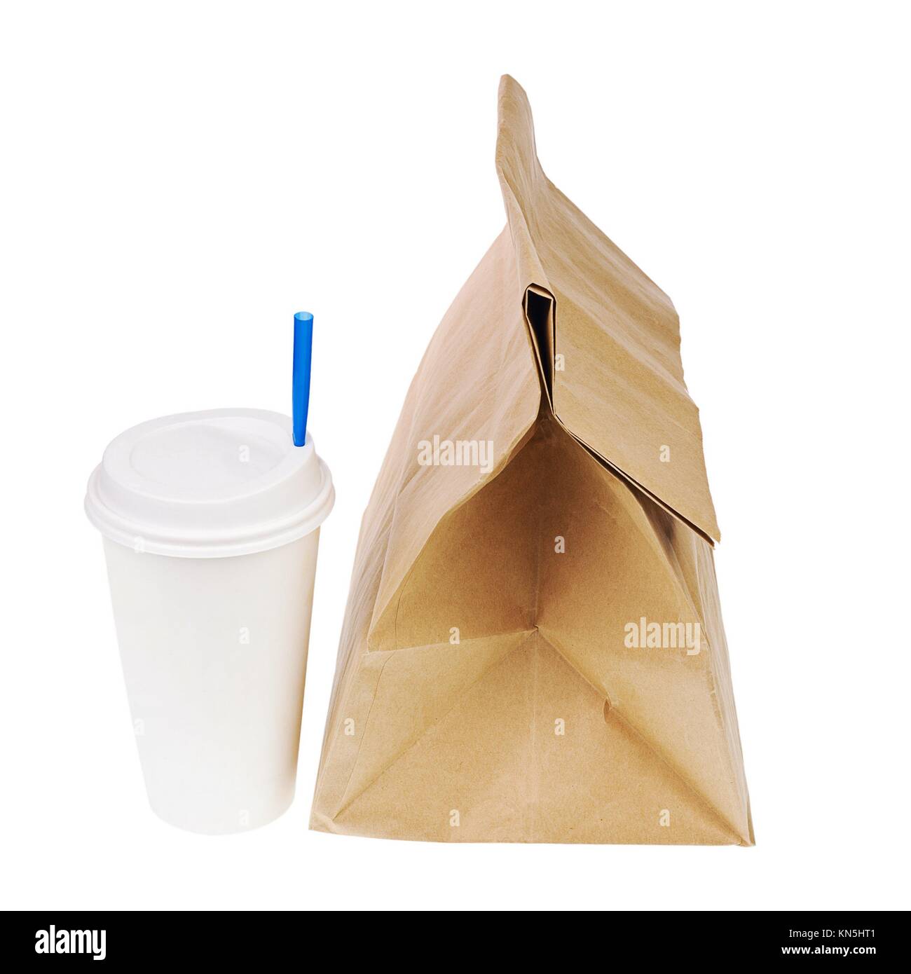 Lunch brown recycle paper bag and cup of coffee or tea with blue tube for drinking isolated on white background. Side view. Stock Photo