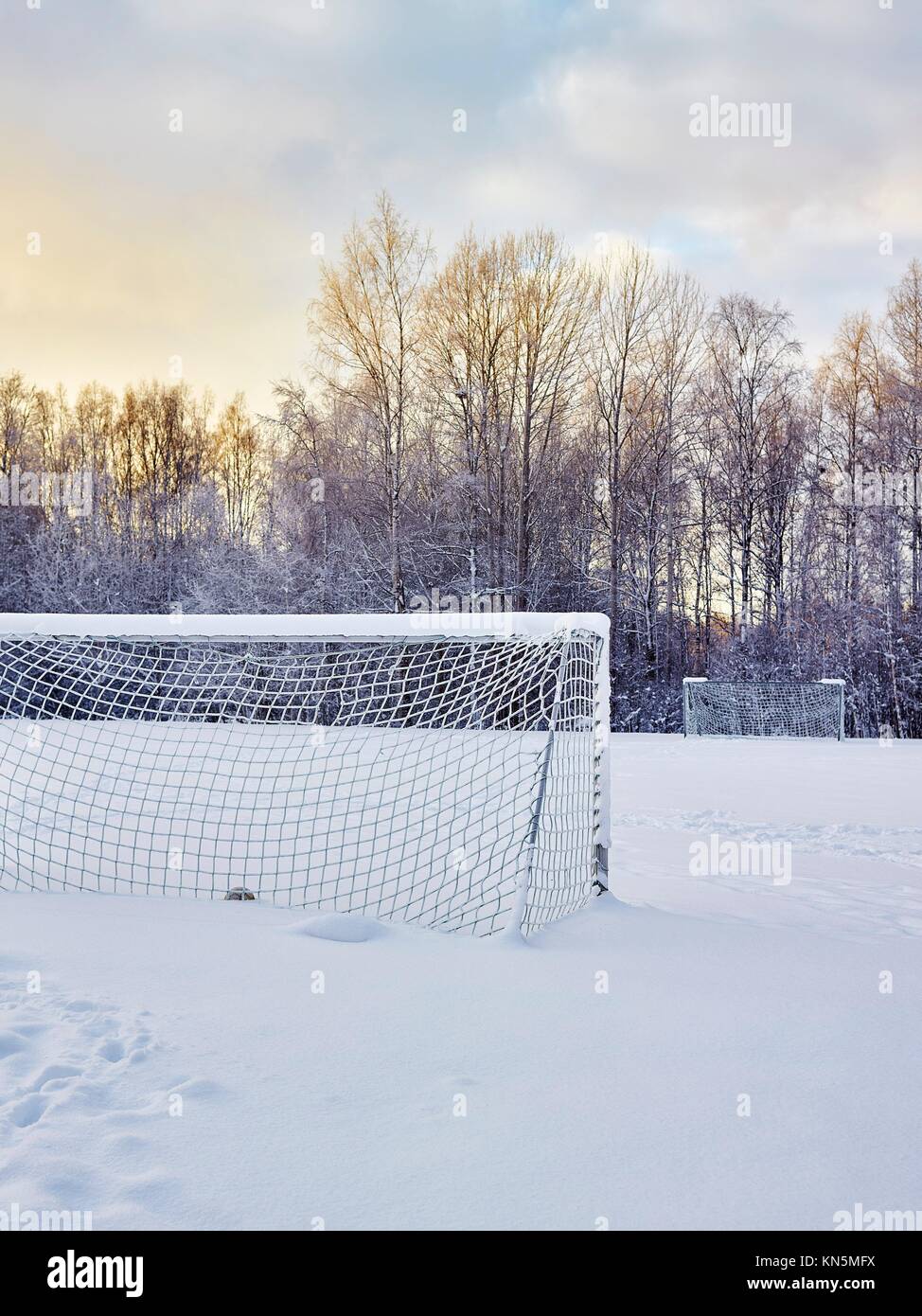 Snowy soccer field in December, frost and cold weather Stock Photo Alamy