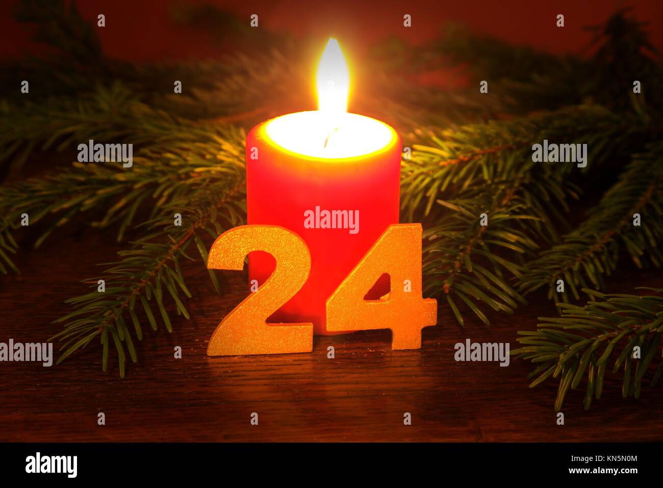 Christmas Eve, red candle. Stock Photo
