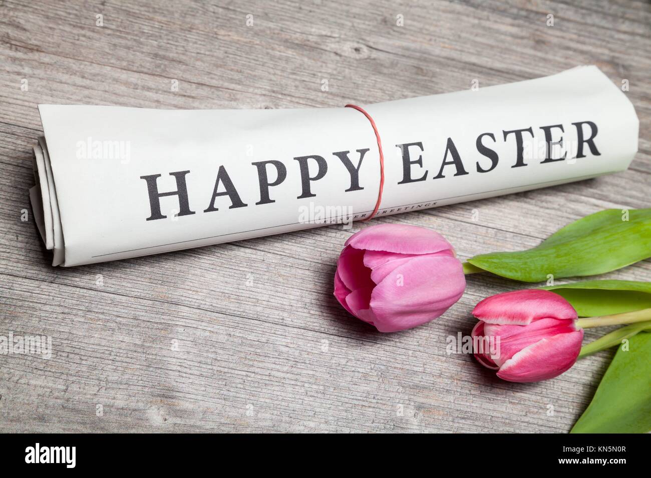 happy easter"" newspaper and tulips Stock Photo Alamy