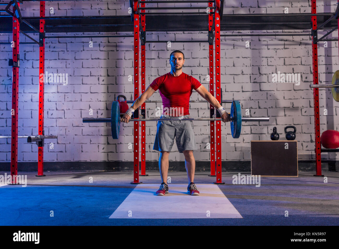 Barbell weight lifting man weightlifting workout exercise gym Stock