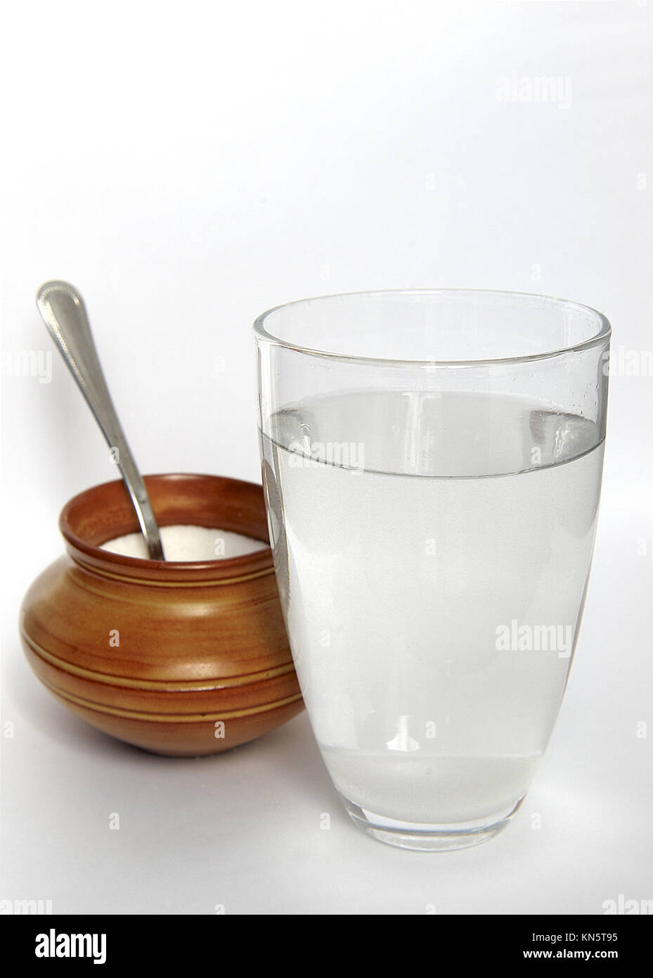 a glass of water with sugar. Stock Photo