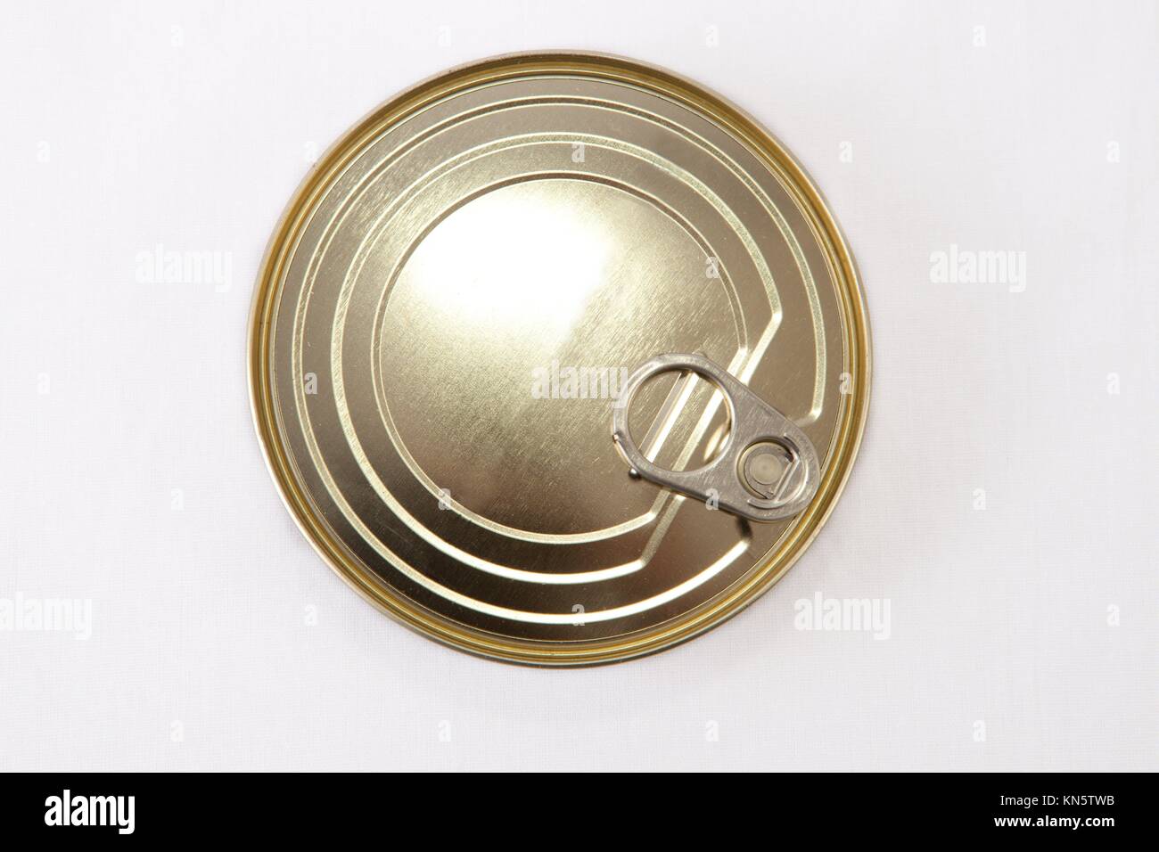 Closed Circular tin can isolated over white background. Selective focus. Stock Photo