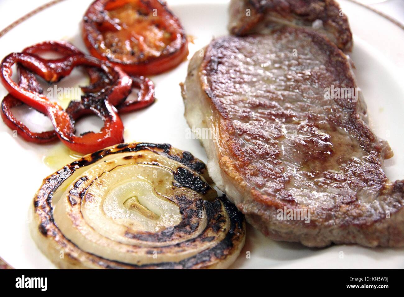 Sirloin on plate onion and pepper Spain Stock Photo Alamy