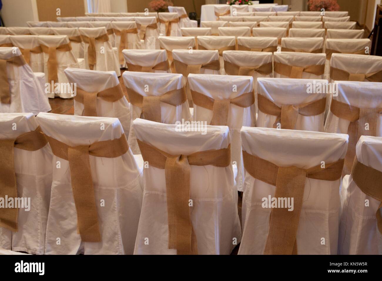 Rows of chairs at a wedding ceremony indoors. Stock Photo