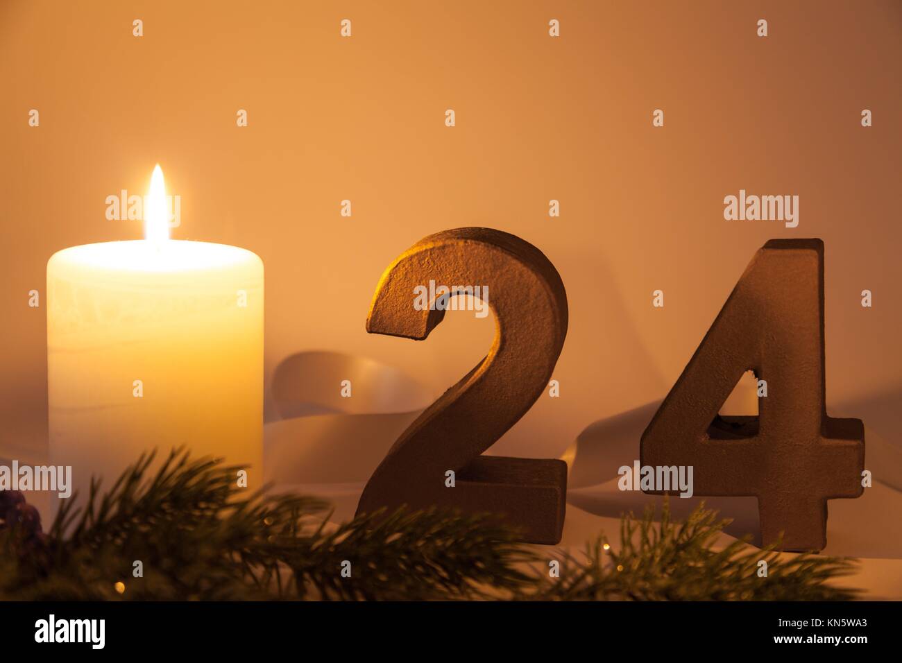 24th of december with white candle. Stock Photo