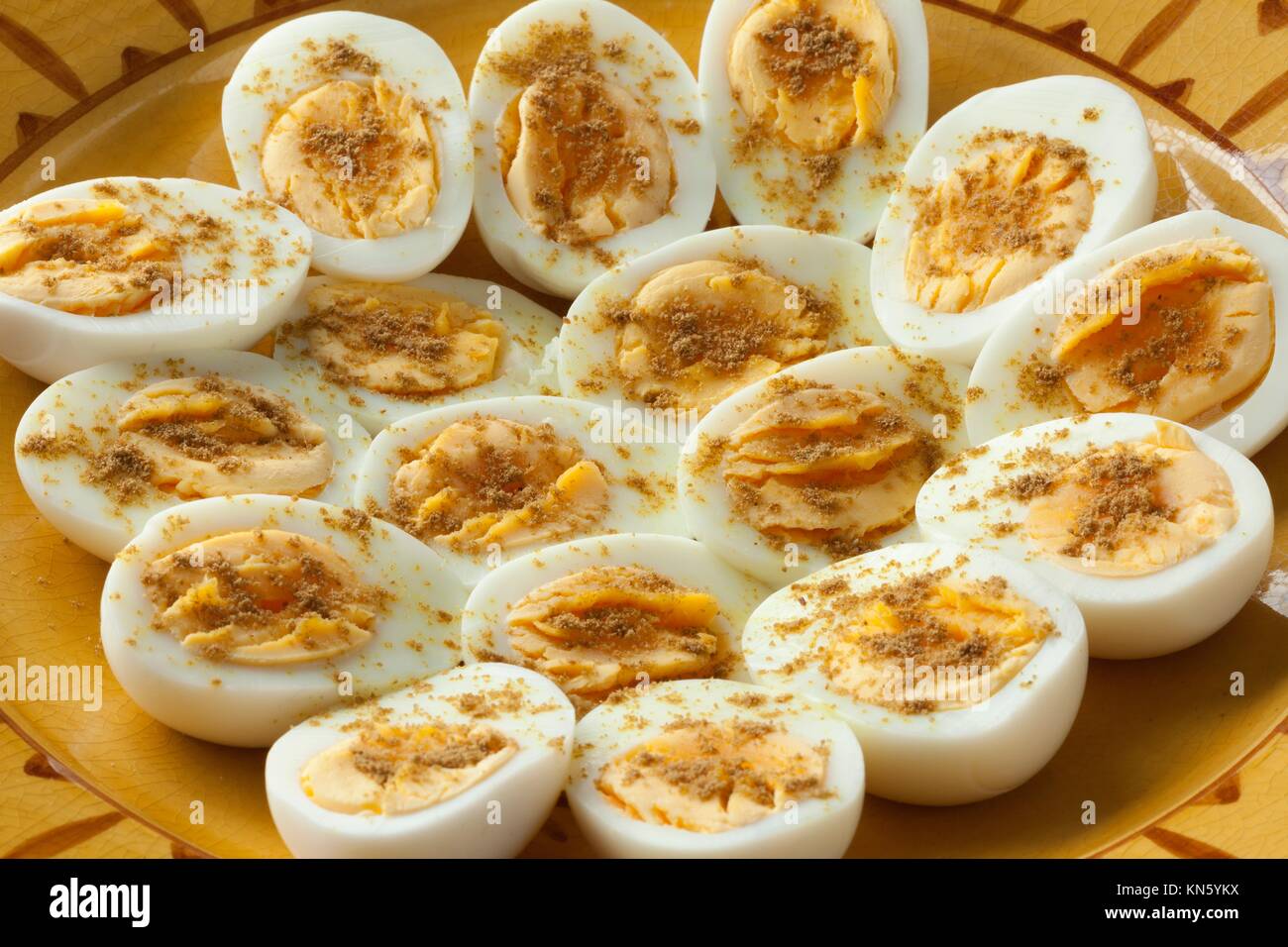 Moroccan traditional boiled eggs with salt and cumin for iftar in ramadan time close up. Stock Photo