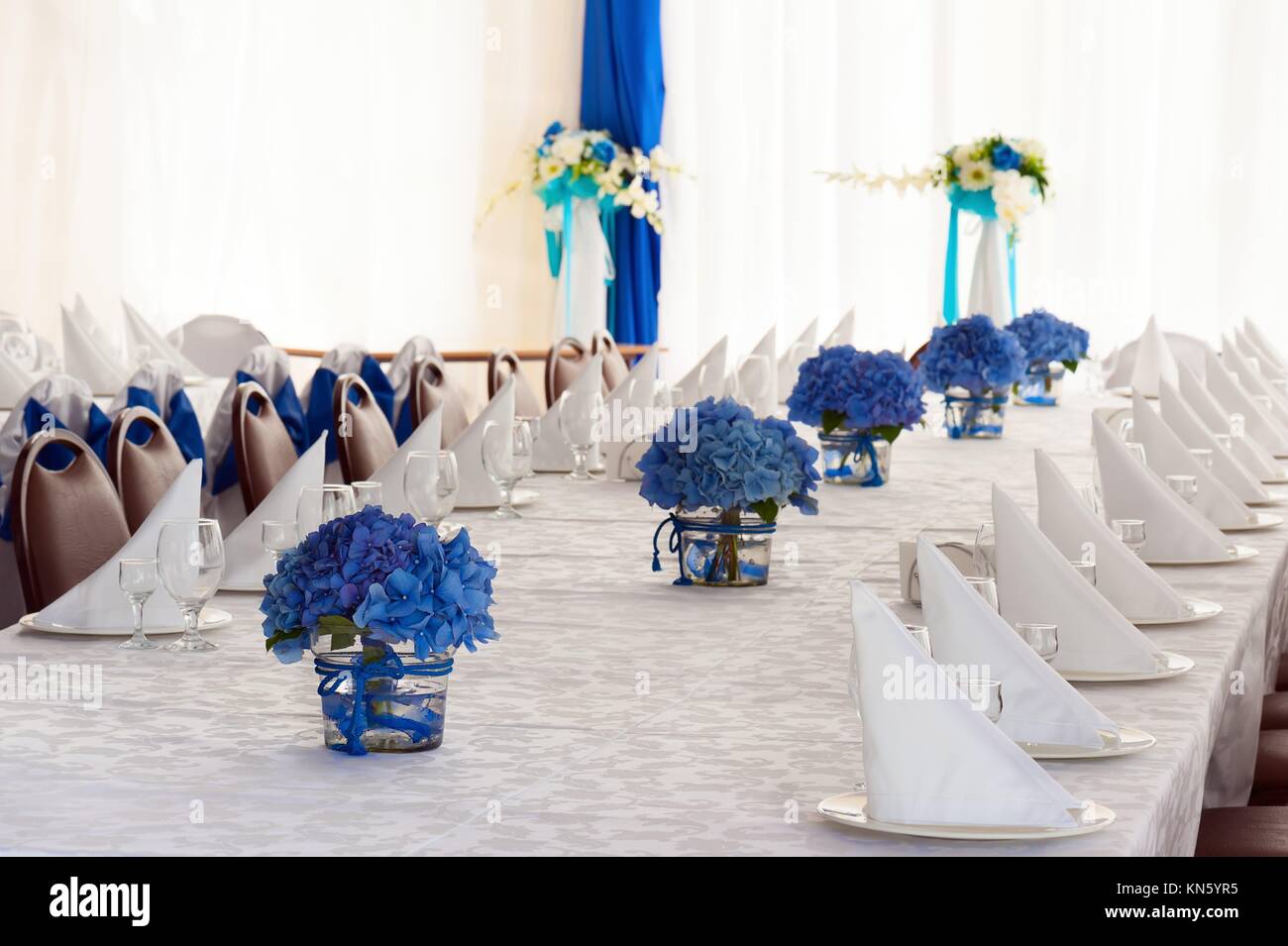 Hydrangea Flowers in Glass Vases on Festive Table with Cutlery Stock