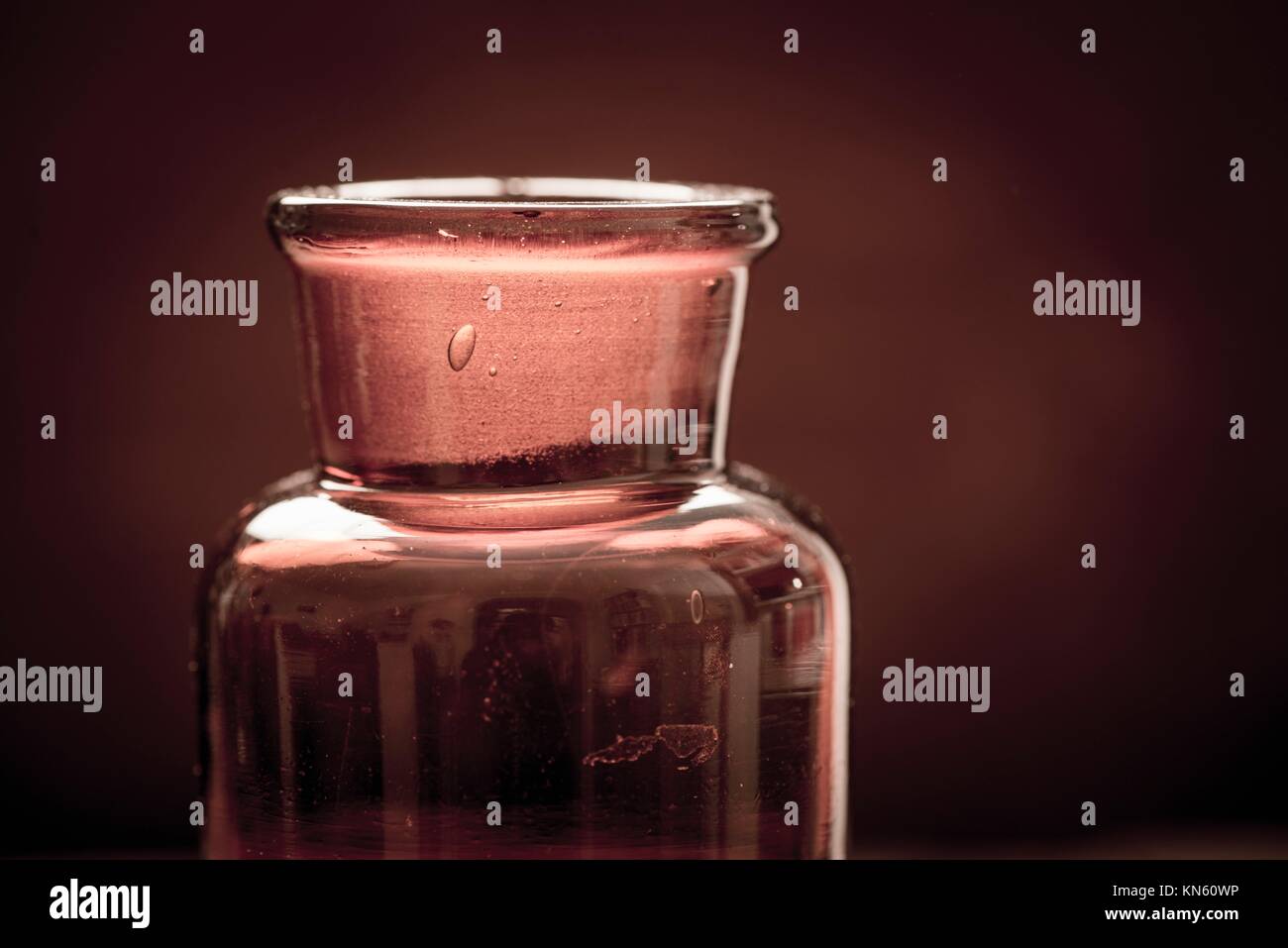 Old fashioned brown glass bottle. Conceptual image of historical
