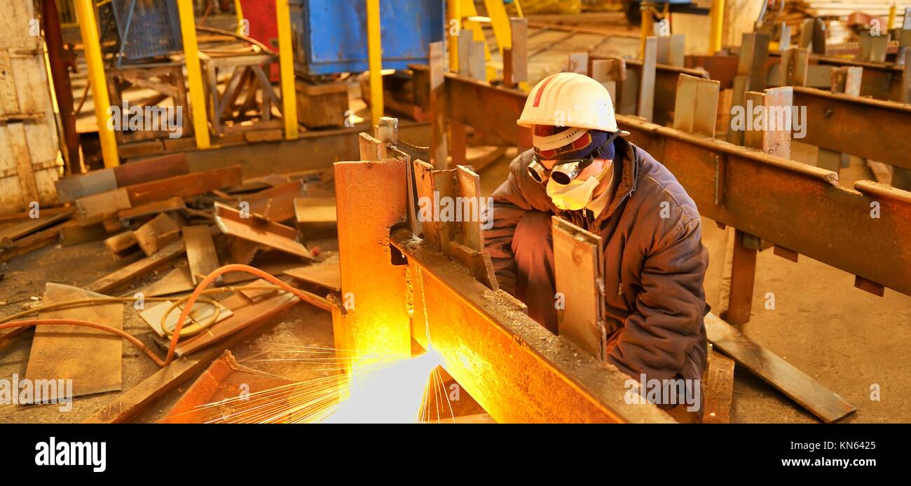 worker using torch cutter to cut through metal Stock Photo Alamy
