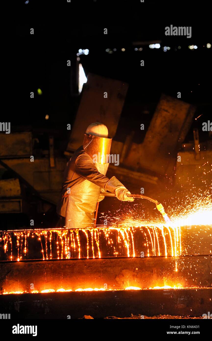 worker using torch cutter to cut through metal Stock Photo Alamy