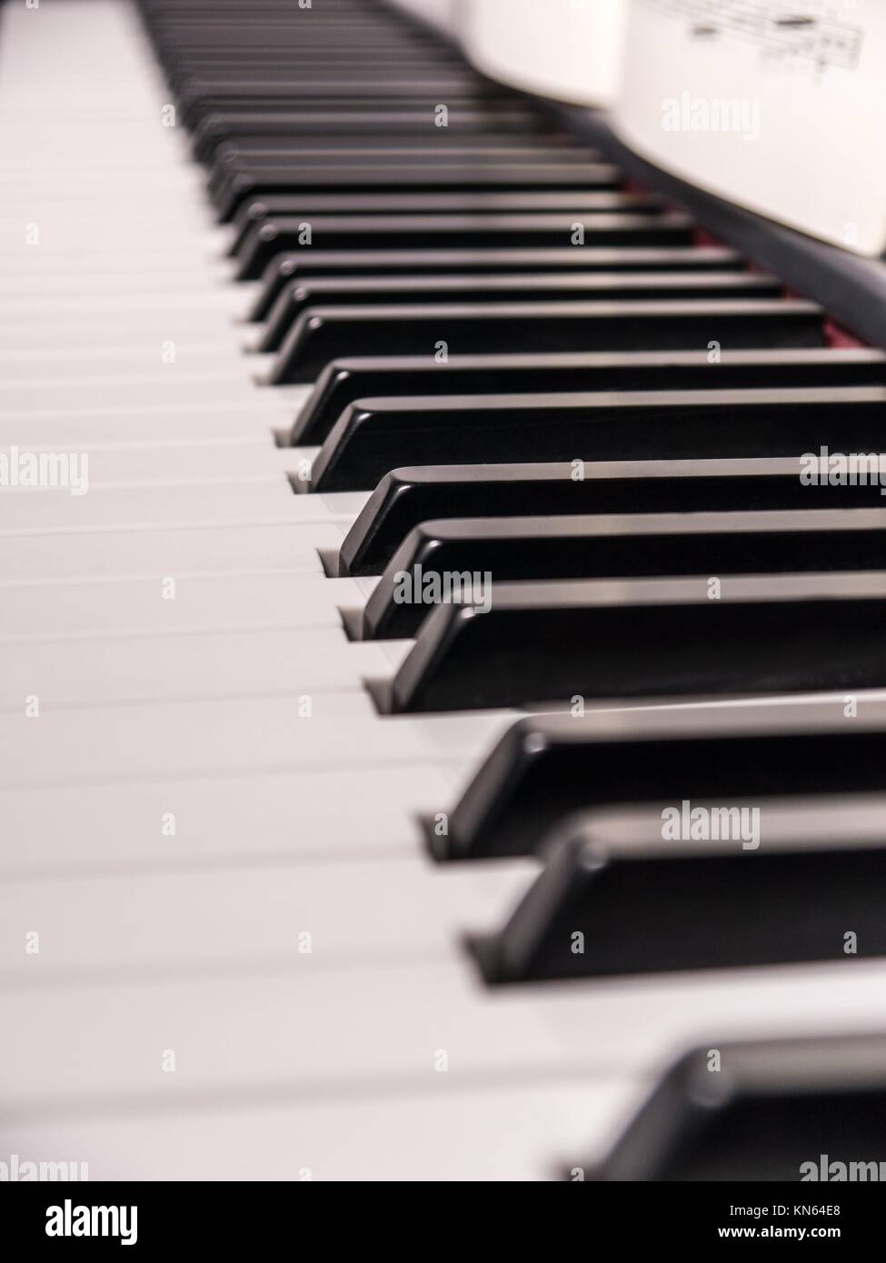 piano keys and music sheet (background). Stock Photo
