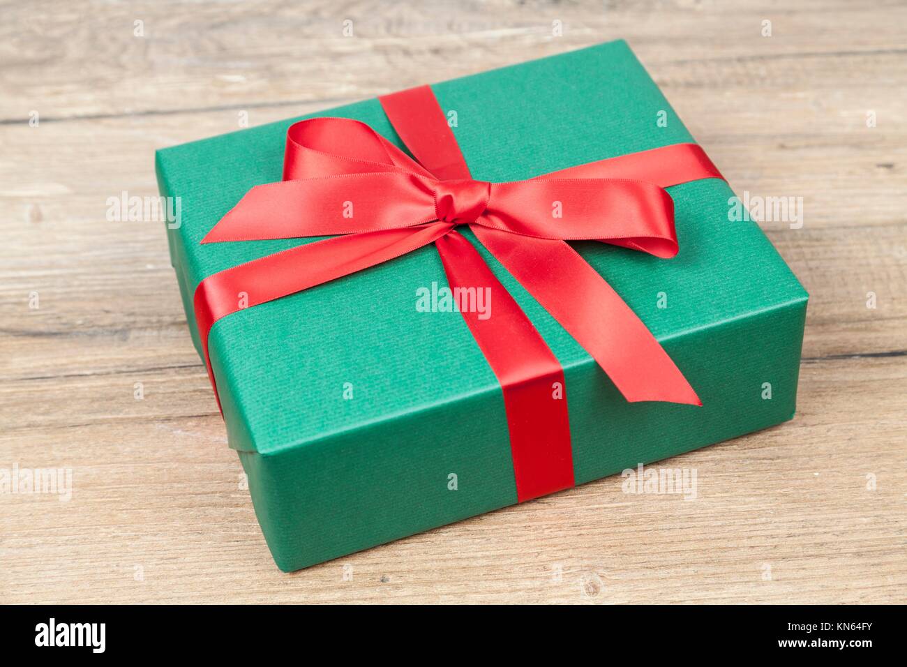 Green Christmas present Stock Photo - Alamy